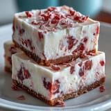 No-Bake Strawberry Fudge Squares chilled and sliced, showcasing a creamy white chocolate texture and easy homemade dessert presentation.