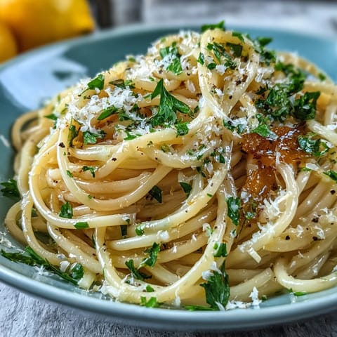 Easy Lemon Butter Pasta with bright lemon zest and silky butter sauce, garnished with fresh parsley and Parmesan.  