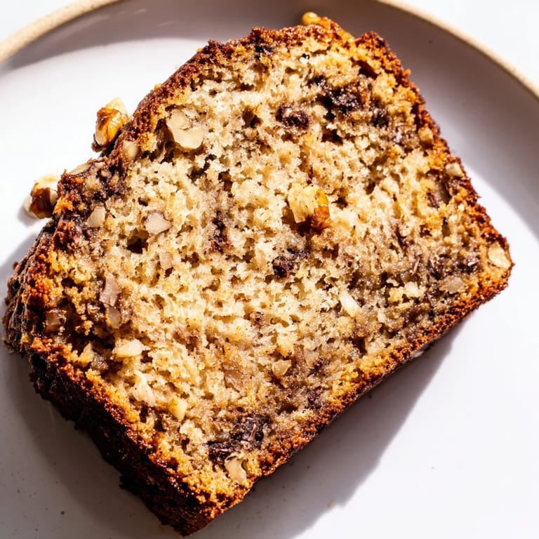 Enjoy the aroma of this freshly baked banana bread, perfect with a warm cup of coffee.