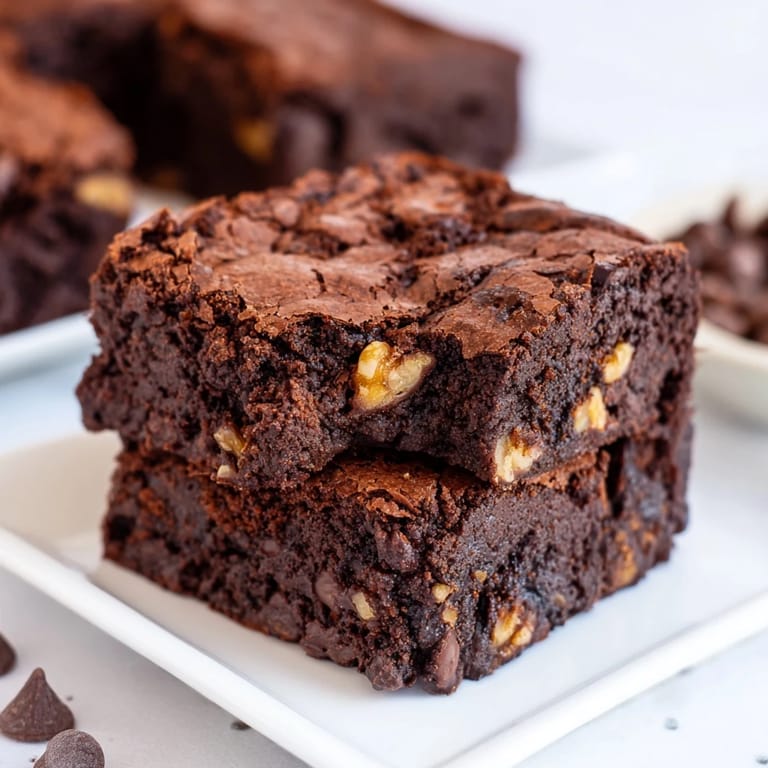 Close-up of decadent brownies, showing their moist interior and perfect for an after dinner treat.