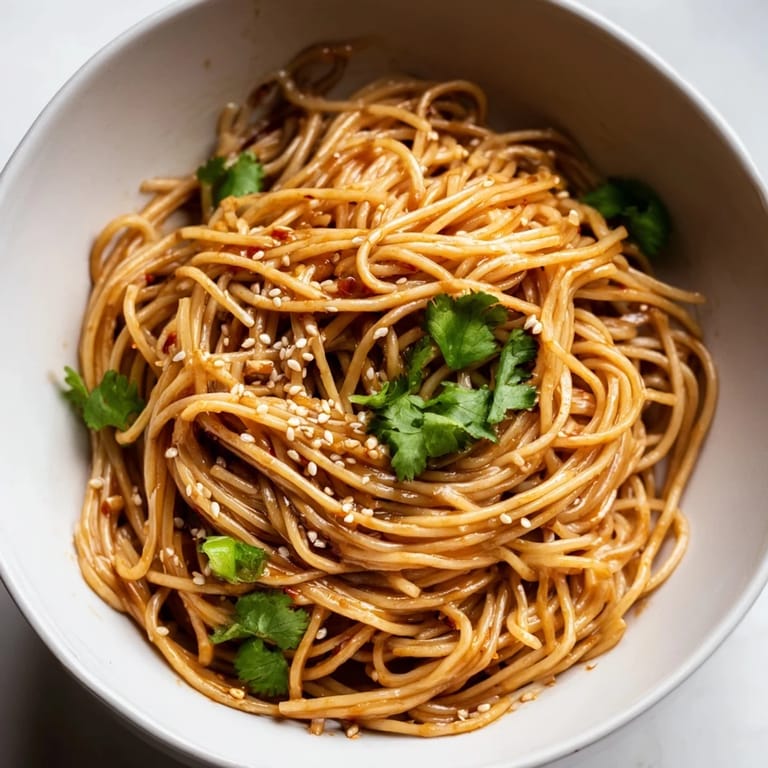 Hearty serving of Spicy Sesame Noodle Salad, perfect for a light vegetarian lunch or dinner.