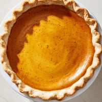 Golden, spiced pumpkin pie, baked till bubbly, ready to be devoured at Thanksgiving.
